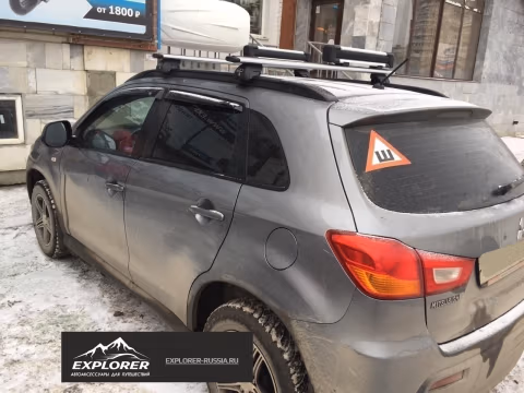 Фото установки крепления Thule SnowPack 4 NEW (7324) для перевозки 4-х пар лыж/сноуборов на Mitsubishi ASX