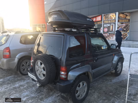 Optima EURO YUAGO (390 л.) Черный (тиснение) на Mitsubishi Pajero Pinin
